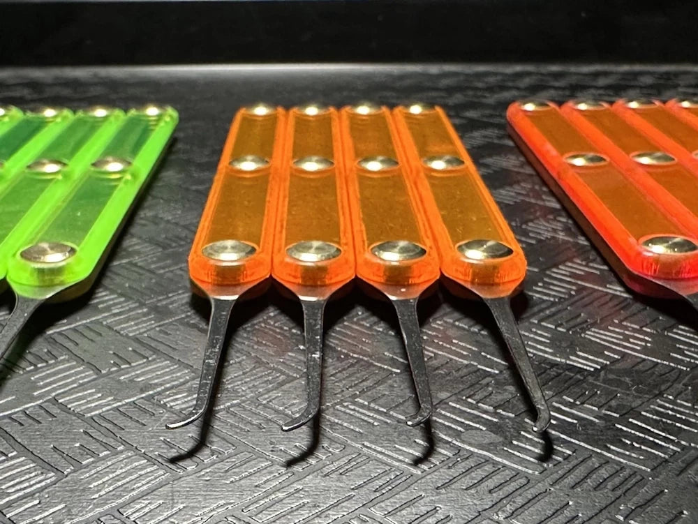 Set of colorful tools on a textured black surface