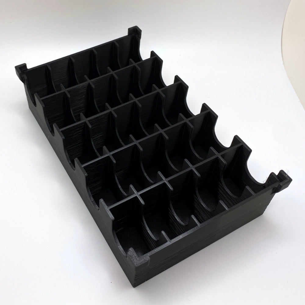 Black plastic organizer with multiple compartments on a white background