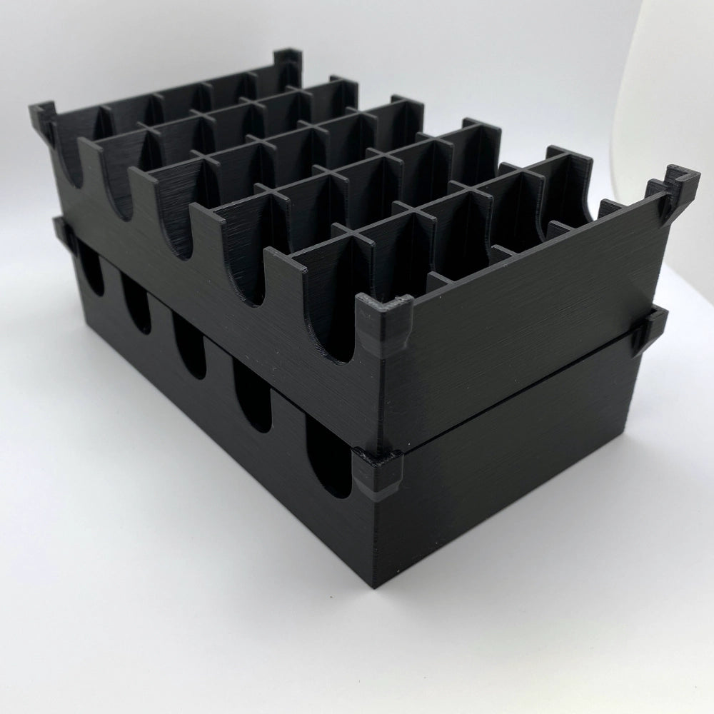 Black plastic crate with multiple compartments on a white background