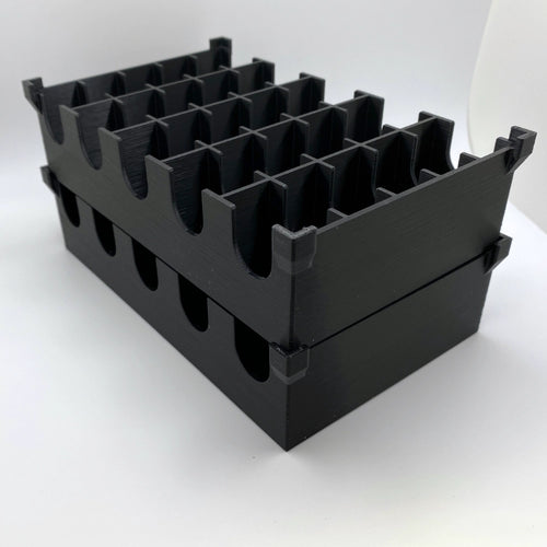 Black plastic crate with multiple compartments on a white background