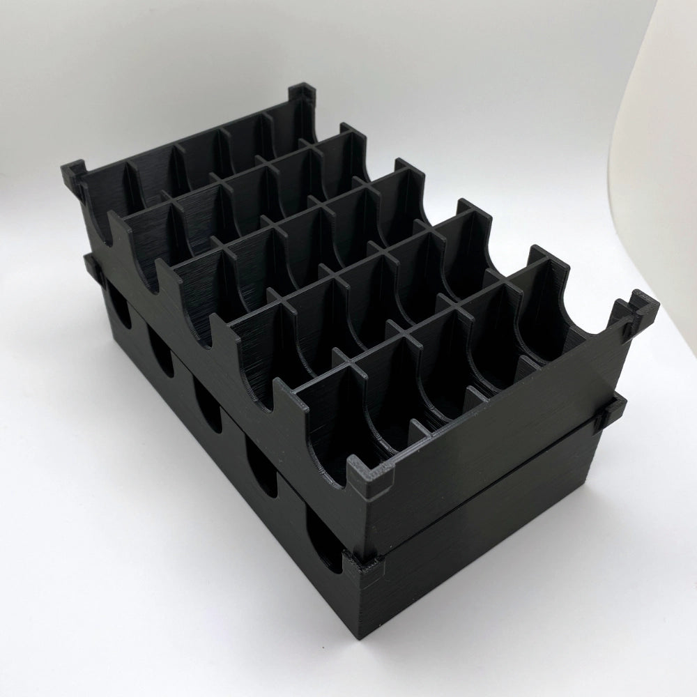 Black plastic grid container on a white background
