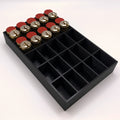 Black tray with compartments holding locks on a white background