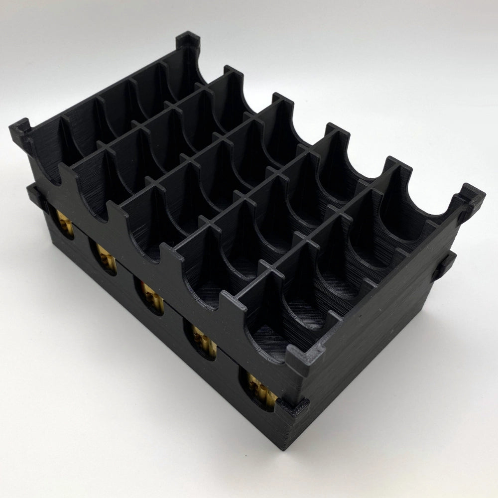 Black plastic component with multiple slots on a white background