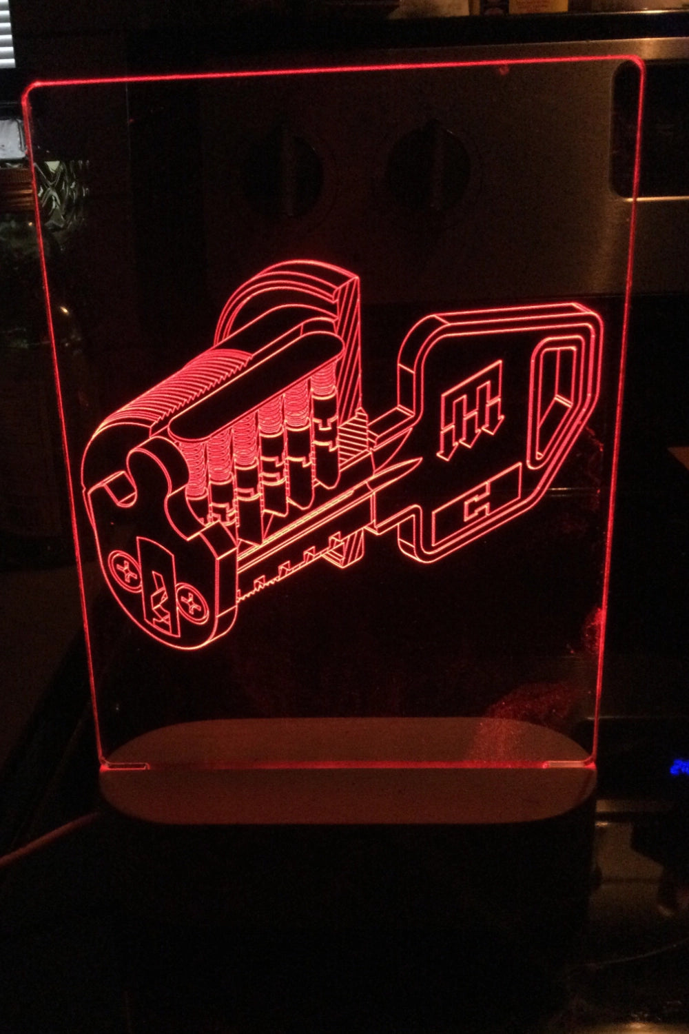 Lock patent art drawing on a red LED lamp in a dark setting
