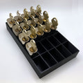 Black tray with compartments holding locks on a white background