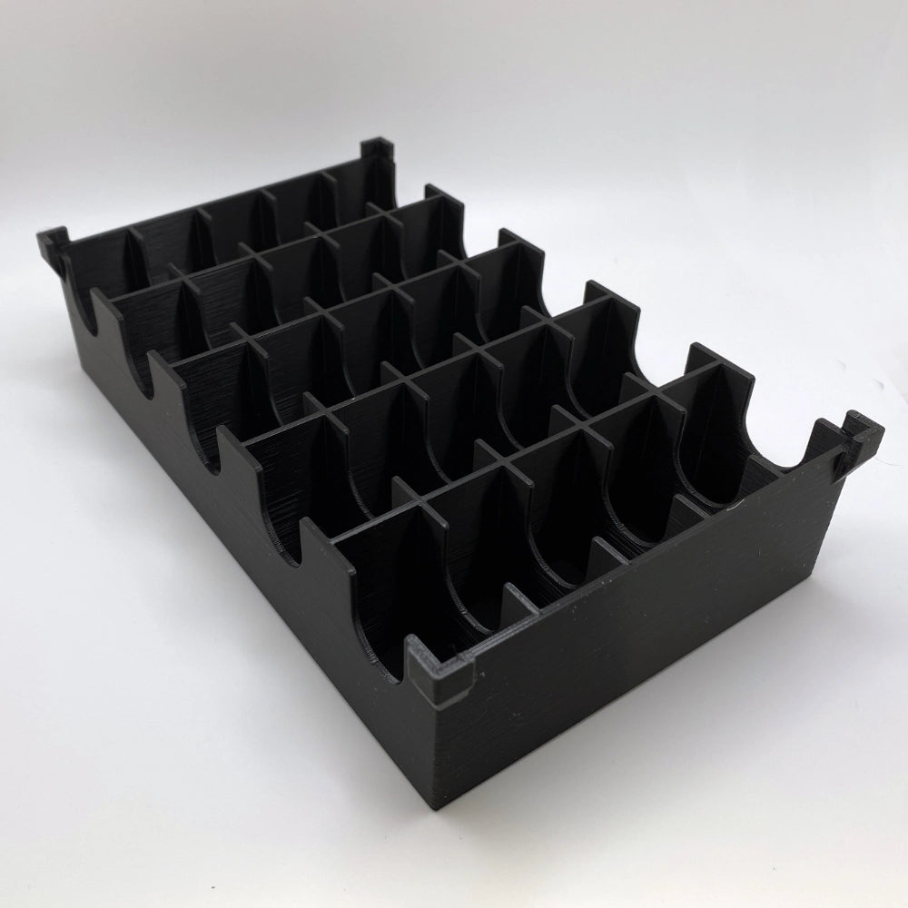 Black plastic compartmentalized tray on a white background