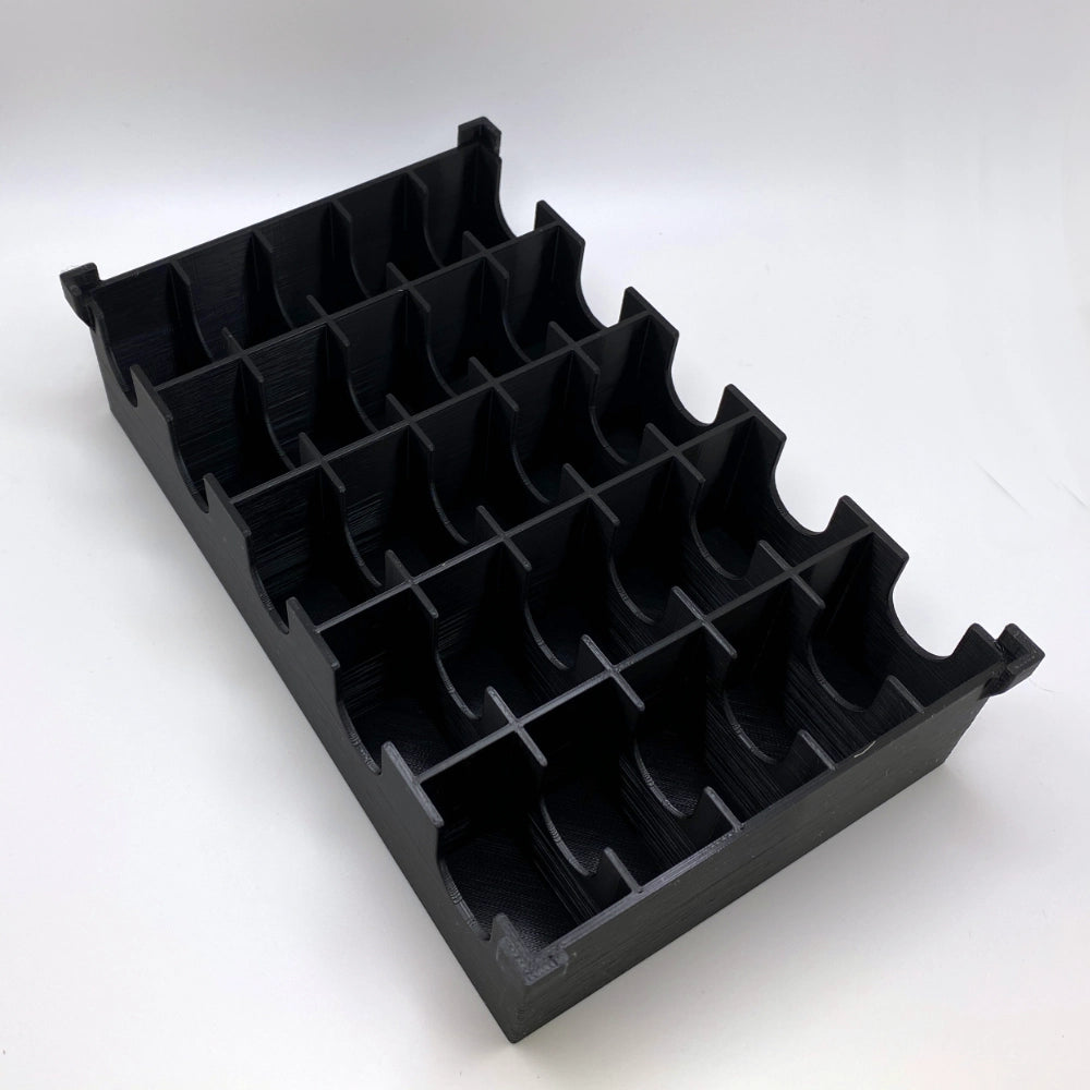 Black plastic organizer with multiple compartments on a white background