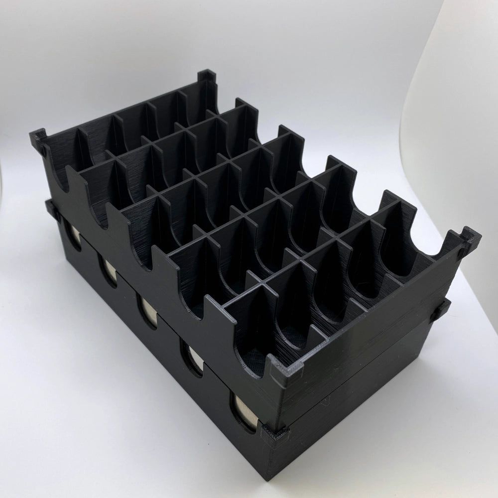 Black plastic crate with multiple compartments on a white background