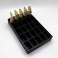 Black tray with compartments holding locks on a white background
