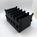 Black plastic crate with multiple compartments on a white background