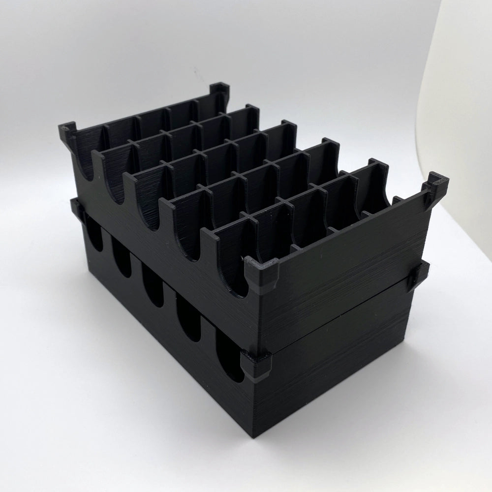 Black plastic crate with multiple compartments on a white background