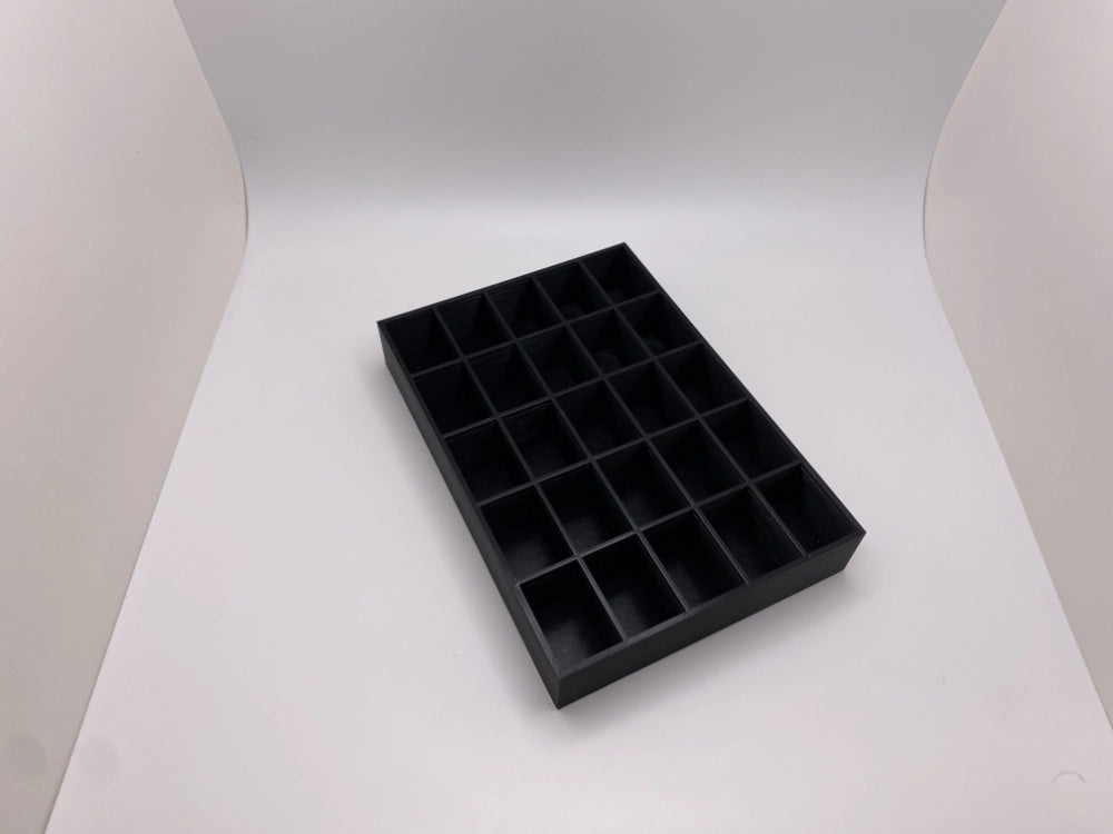 Black tray with compartment on a white background