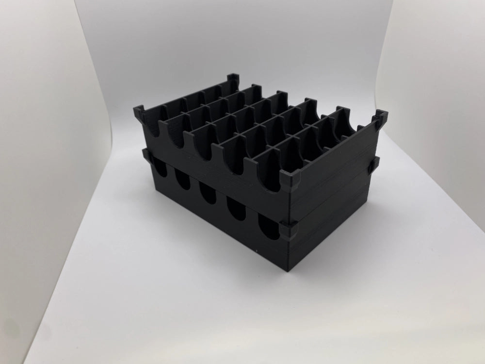 Black plastic crate with multiple compartments on a white background
