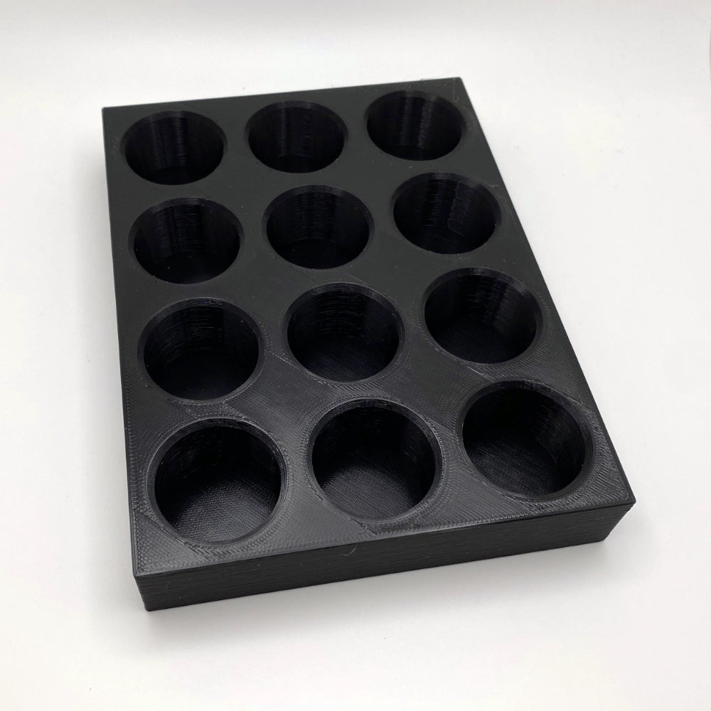 Black tray with compartments on a white background