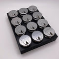 Set of silver locks on a black tray against a white background