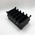 Black plastic component on a white background