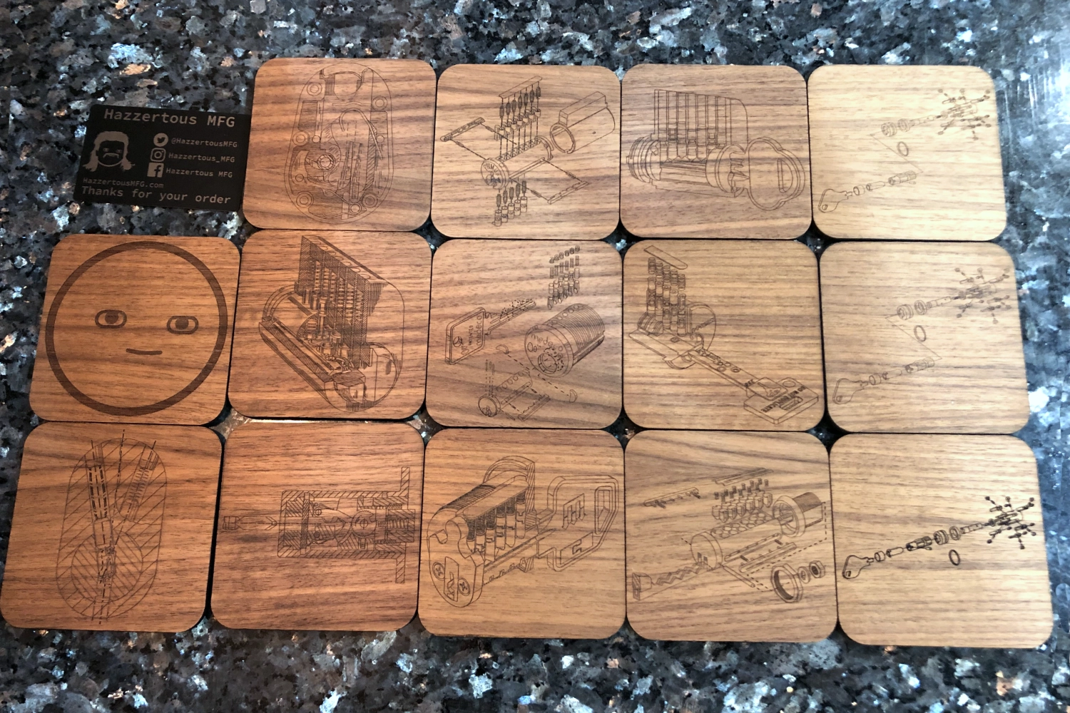 Set of wooden coasters with engraved designs on a dark surface
